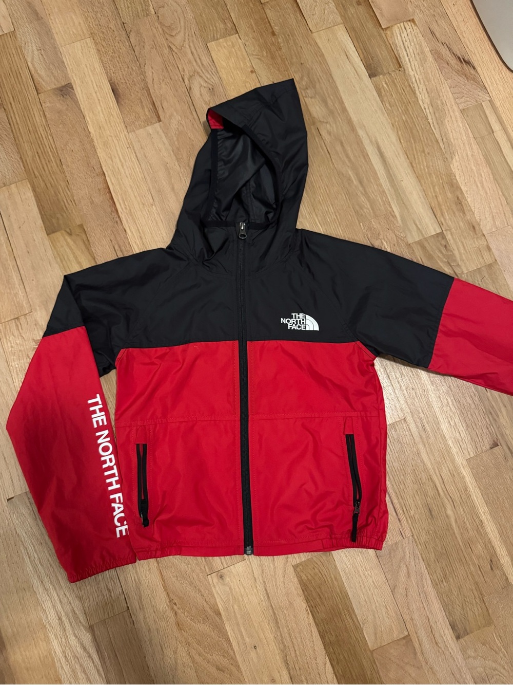 The North Face Kids Red and Black Hooded Rain Jacket